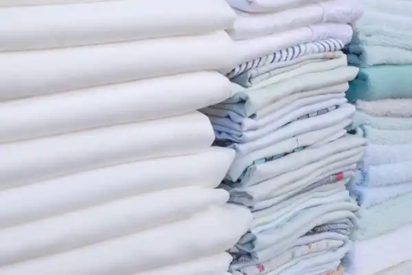 Stacks Of Linens And Clothes 1920X650