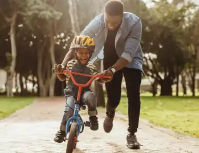 Father Teaching Son To Ride Bike 600X600