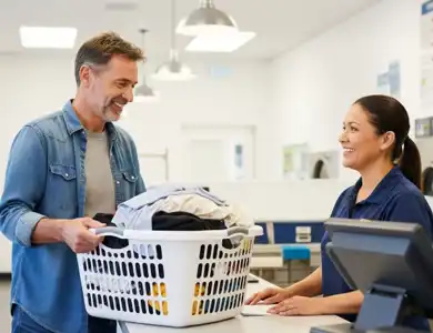 Man In Denim Shirt Dropping Laundry At The Wash And Fold 600X600